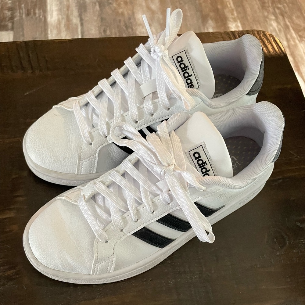 Kids size 5 1/2 adidas sneakers. White with black stripes. Only worn 3 times!